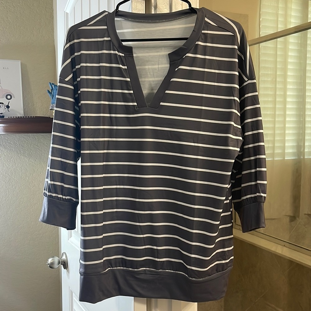 Size large, very soft and comfy shirt, 3/4 sleeves. NBW and SFPF home